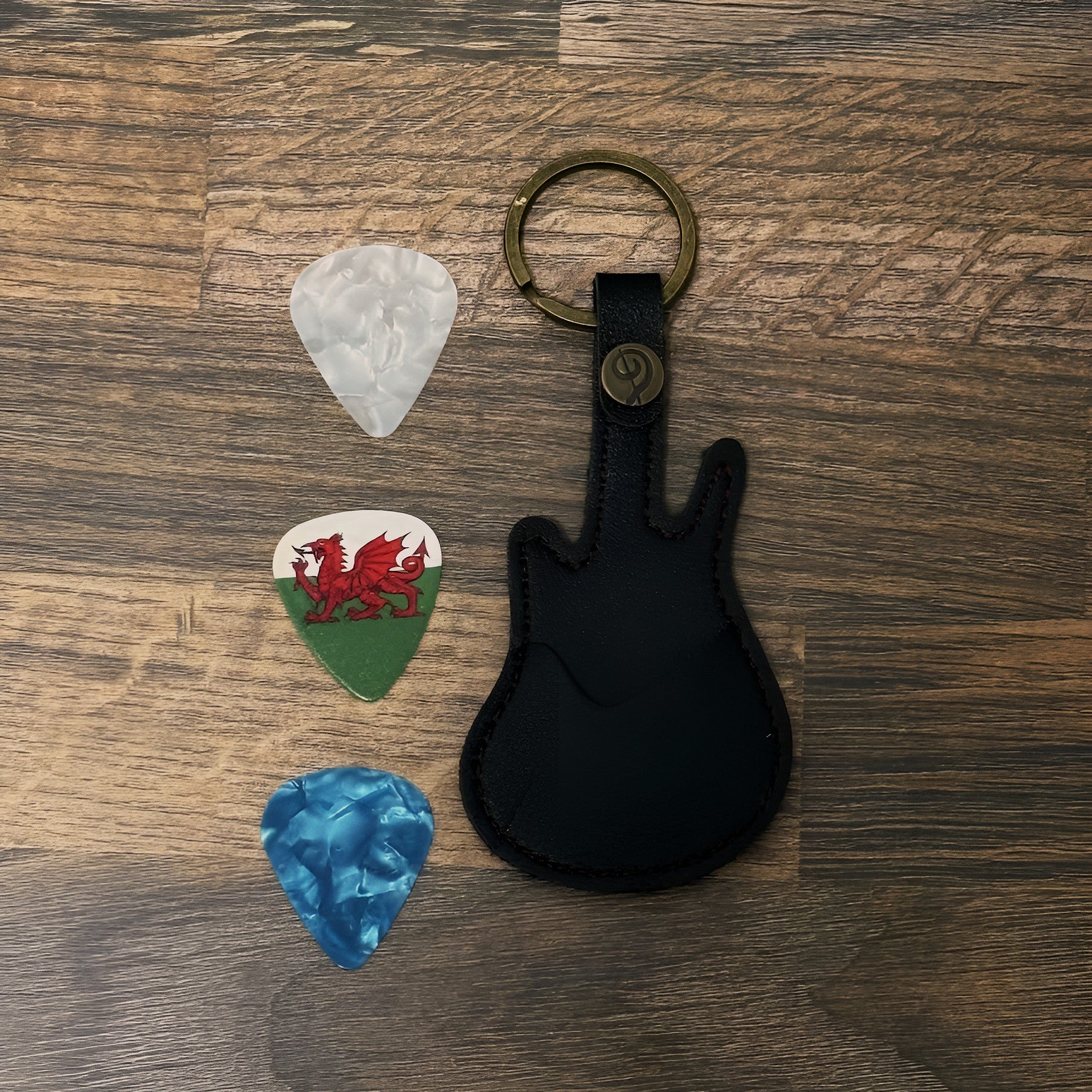 Guitar shaped pick holder